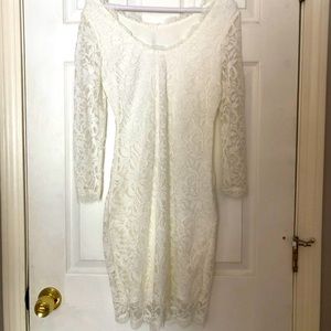 White lace knee-length dress with long sleeves